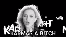 a black and white photo of a woman with the words karmas a bitch on the bottom