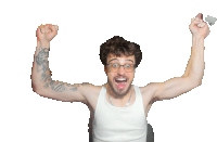 a man with glasses and a tattoo on his arm holds his fist up