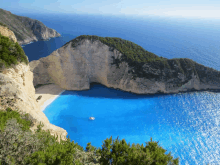 a large body of water with a cliff in the middle