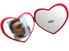 a heart shaped mirror with a picture of a man and the name jan