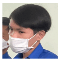 a man wearing a blue shirt is wearing a white face mask