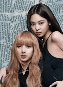 two women posing for a picture with one wearing a black shirt that says " jennie "