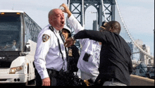 a group of police officers standing on a bridge