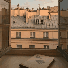 a book with a shadow of a bird on it