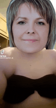 a woman with a bow tie on her chest has a tiktok account