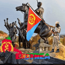 a statue of a man riding a horse holding a flag with the word eritrea in the corner