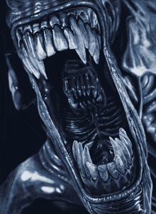 a close up of a monster 's mouth and teeth