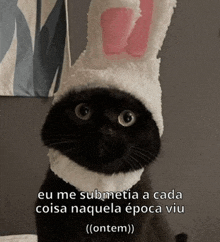 a black cat wearing a white hat with pink bunny ears says eu me submetia a cada cosa naquela epoca viu