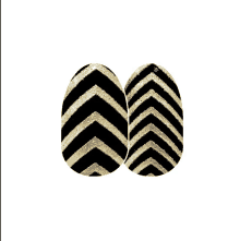 a pair of black and gold nails with a chevron pattern