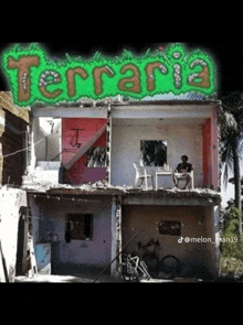 a man sits on the roof of a building with terraria written on the top