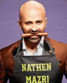 a man wearing an apron that says nathan mazri on it