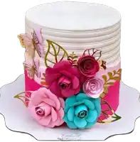 a pink and white cake with paper flowers and butterflies on top