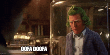 a man with green hair is standing in front of a glass jar that says oofa doofa on it