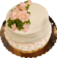 a white cake with pink frosting and roses on it