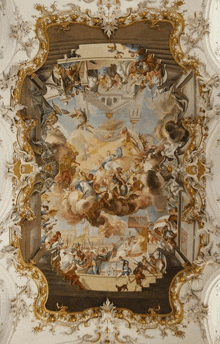 a large painting on the ceiling of a building with a gold frame around it