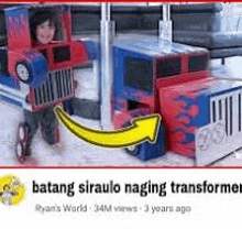 a child is dressed as a transformer from a cardboard box and is standing next to a cardboard truck .