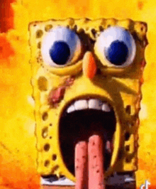 spongebob squarepants is making a funny face with his tongue out .