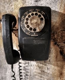 a black telephone with the word operator on the front