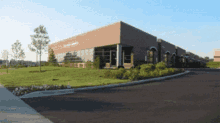 a large brick and glass building with a sign that says holiday center