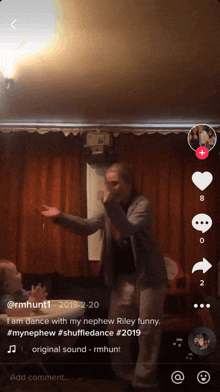 a screenshot of a tiktok video of a man dancing with his nephew riley