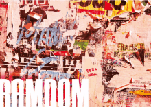 a wall with a lot of torn posters and the word random in white