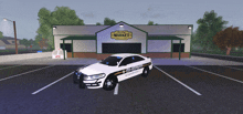 a sheriff 's car is parked in a parking lot in front of a shopping market