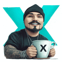 a man with a beard is smiling while holding a cup with the letter x on it