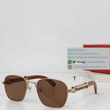 a pair of sunglasses sits on a table next to a card that says " wholesale price "