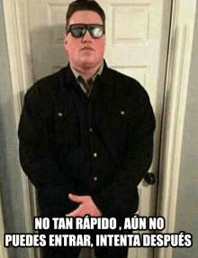 a man wearing sunglasses and a black jacket is standing in front of a door with the caption no tan rapido