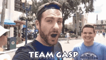 a man taking a selfie with the words team gasp written on the bottom