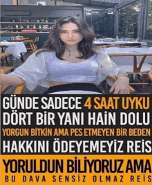 a woman is sitting in a chair with a sign that says ' sadece 4 saat uyku '