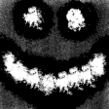 a black and white photo of a smiley face with smoke coming out of it 's eyes .