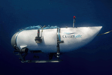 a white oceangate titan is floating in the ocean