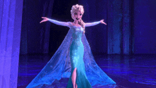 a cartoon character in a blue dress is standing in a dark room with her arms outstretched