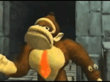 donkey kong is wearing a tie and gloves and standing in a dark room .