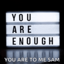 a sign that says `` you are enough '' and '' you are to me sam ''