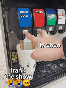 a person is pouring a drink into a cup that says frank the show on it