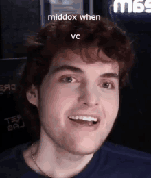 a close up of a man 's face with the words middox when vc on the bottom