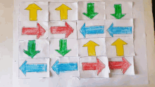 a bunch of different colored arrows are lined up on a piece of paper