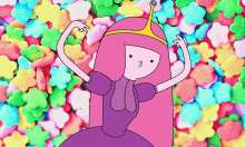 princess bubblegum from adventure time is dancing in front of a pile of colorful candy