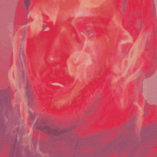 a close up of a man 's face with smoke coming out of it