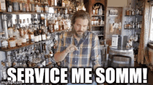 a man in a plaid shirt stands in front of a shelf full of liquor bottles with the words service me somm