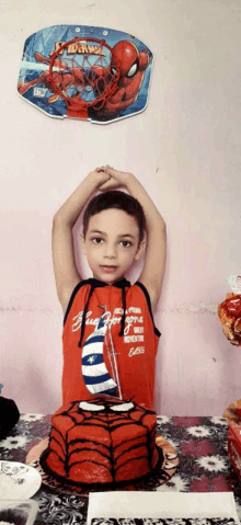 a young boy wearing a red shirt that says " bug for gone "