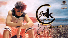 a man wearing sunglasses sits on a rocky beach in front of a logo for jeik escaparnos