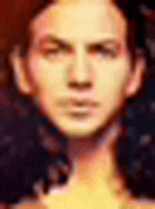 a close up of a man 's face with his eyes closed and a blurred background .