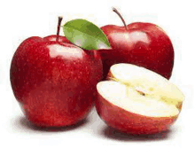 three red apples with green leaves and a sliced apple .