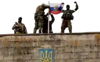 a group of soldiers standing on top of a brick wall holding a russian flag