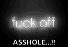 a neon sign that says fuck off asshole !!