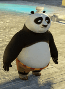 a panda bear wearing shorts is standing on a sidewalk in front of a pool