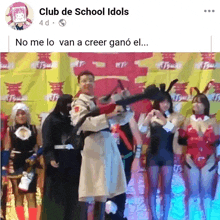 a group of people standing in front of a banner that says club de school idols on it